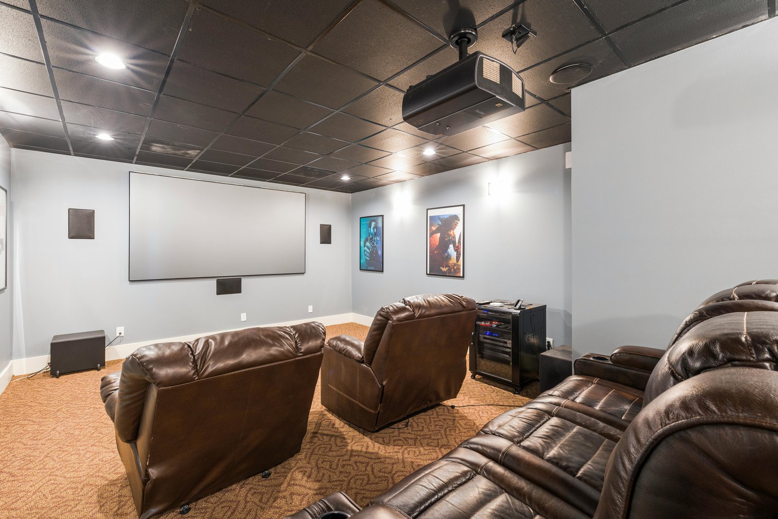 Wall-mounted television and home theater system setup in a living room